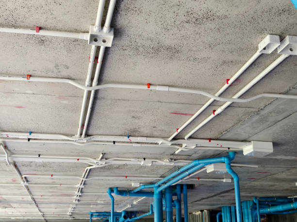 Ceiling installation with conduit piping by Mike Coating & Maintenance