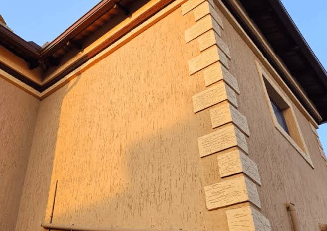 Gamazine textured wall coating applied to residential building exterior in South Africa